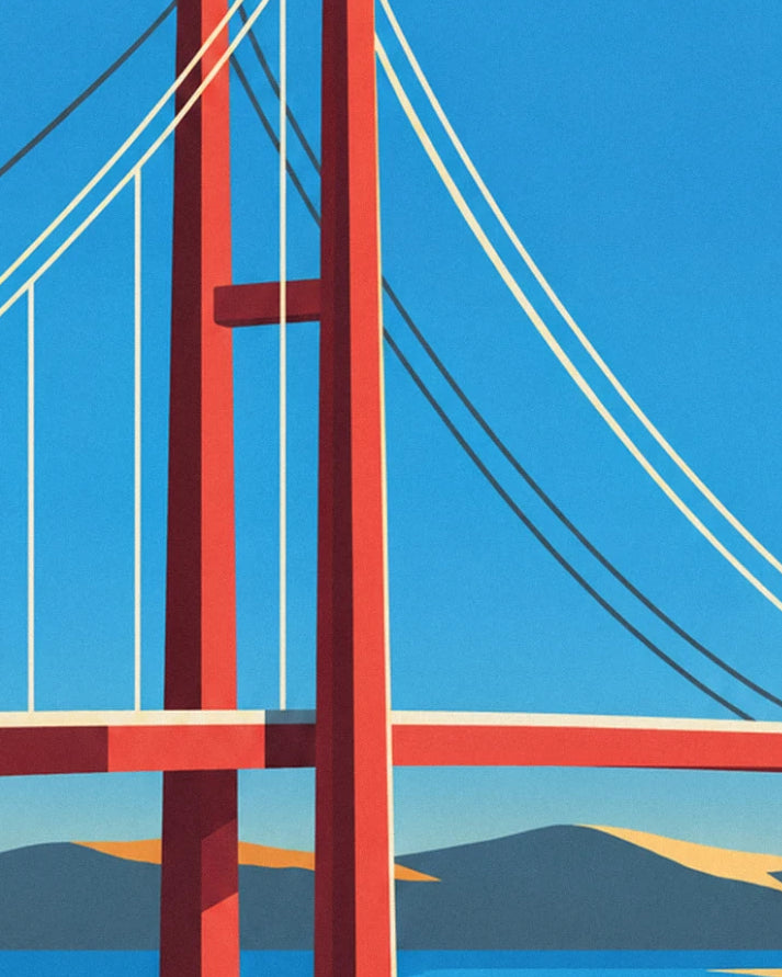Les pylônes rouges du pont et ses câbles suspendus, sur fond de ciel bleu