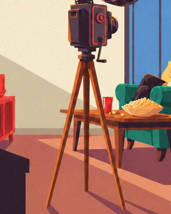 La caméra sur son trépied en bois, près du fauteuil vert et du bol de pop-corn