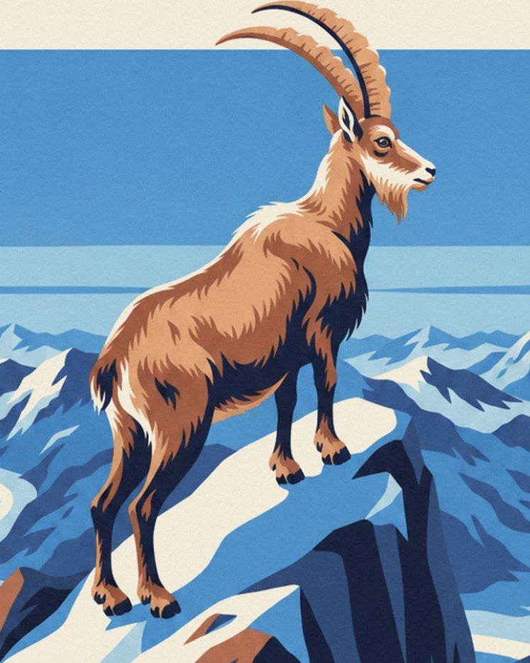 Le bouquetin aux longues cornes recourbées sur un sommet enneigé de la Vanoise