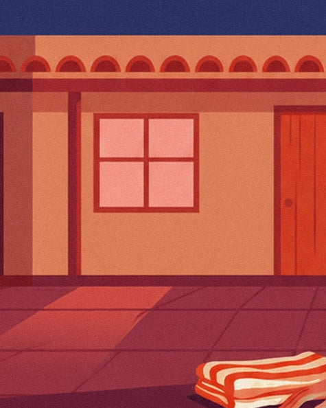 La façade ocre du motel, sa fenêtre rose et une serviette rayée au bord de la terrasse
