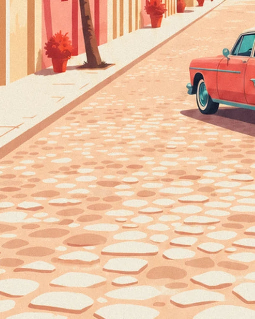 Pavés clairs, pots de fleurs rouges le long des façades roses et voiture rouge à droite