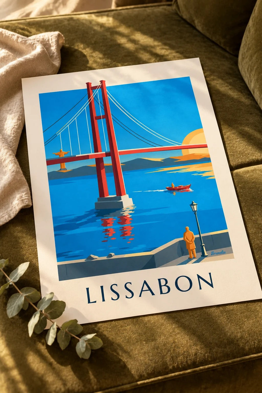 Affisch med 25 april-bron över Tejo i Lissabon: liggande på ett bord