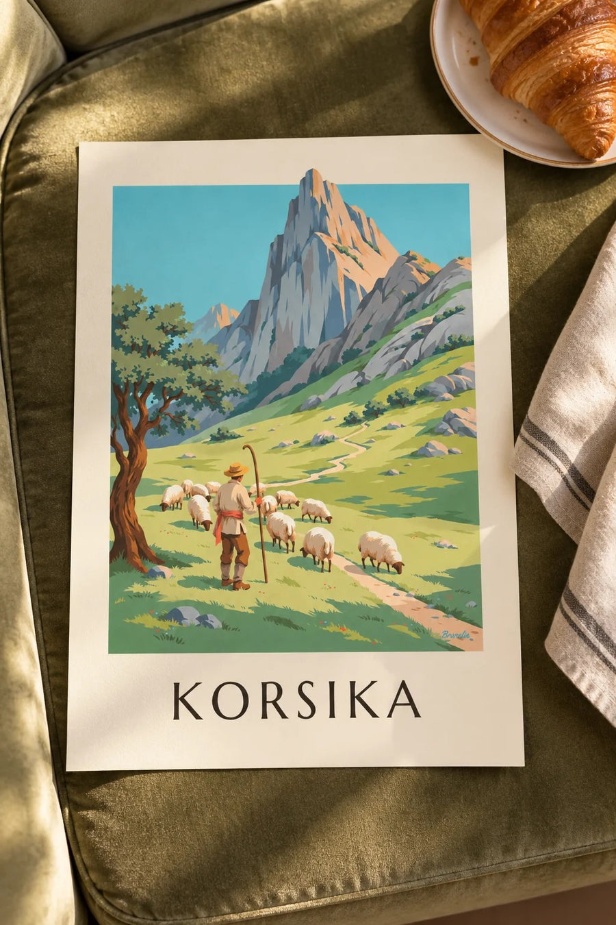Affisch med herde och får i Korsikas berg: liggande på ett bord