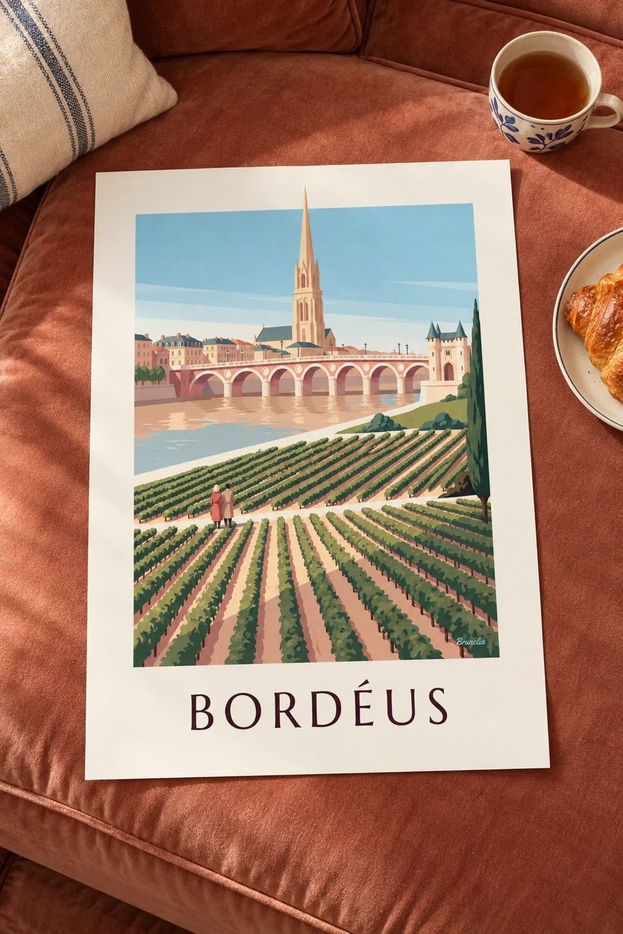 Poster da ponte de pedra e da porta Cailhau em Bordéus vistas das vinhas: pousado numa mesa