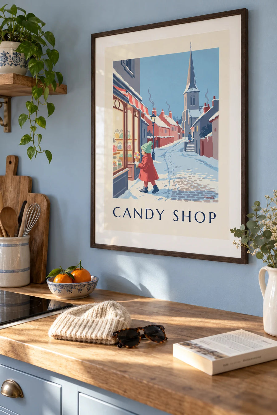 Affiche fillette et cornet de bonbons devant une confiserie sous la neige : encadrée au mur